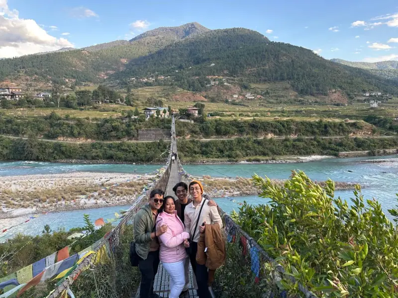 Three travellers on the Punakha suspension bridge