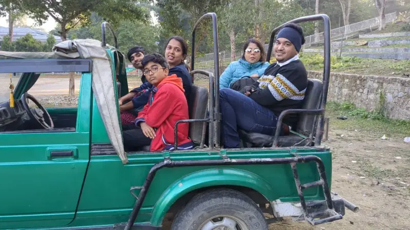 A family in an open safari jeep