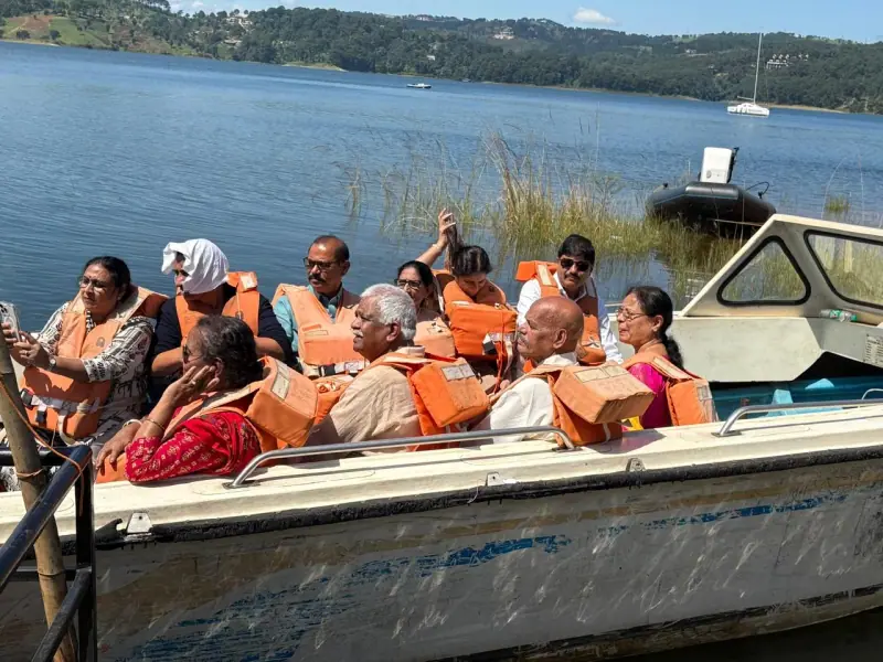 A group in orange life jackets on a boat ride